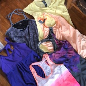 Lot of athletic shirts. Fit like smalls to xs